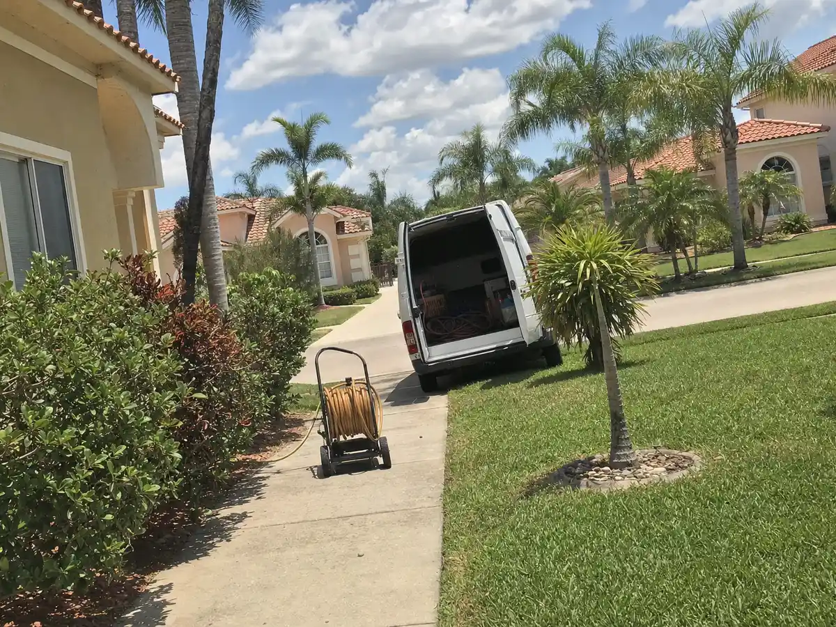 Service van arriving on a Cape Coral, FL street — local same-day coverage